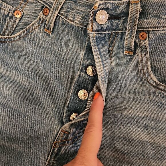 Medium wash distressed button fly, high waist Levi's shorts size 27. - Picture 5 of 9